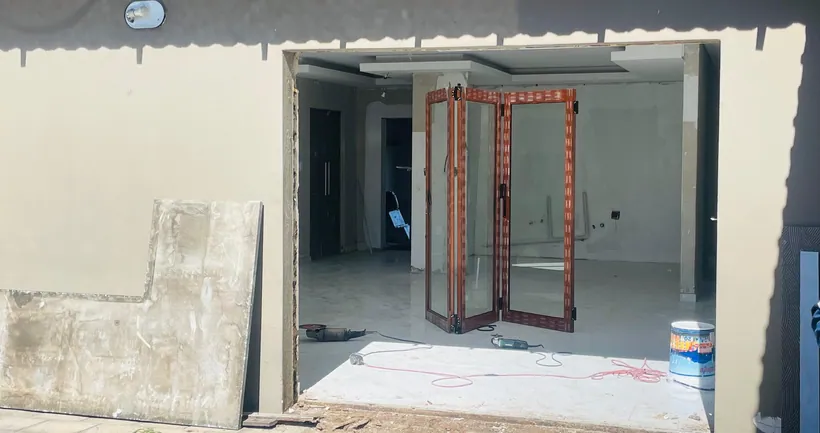 New-build interior with a folding door unit installed and filmed