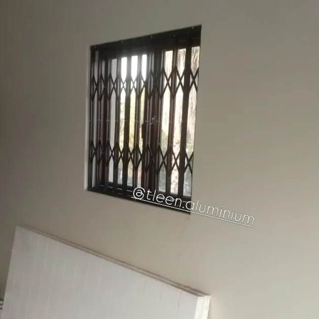Charcoal trellis guard fitted to a bedroom window